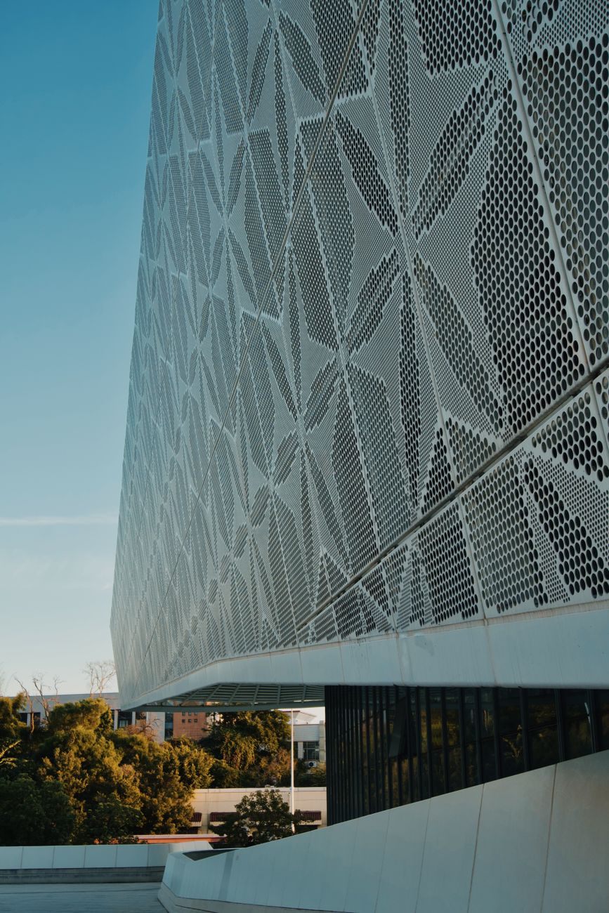 A perforated metal screen facade on a building
